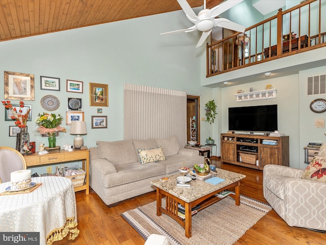 10334 Harp Rd, Walkersville, MD 21793 - living area with high vaulted ceiling, wood finished floors, a ceiling fan, and wooden ceiling