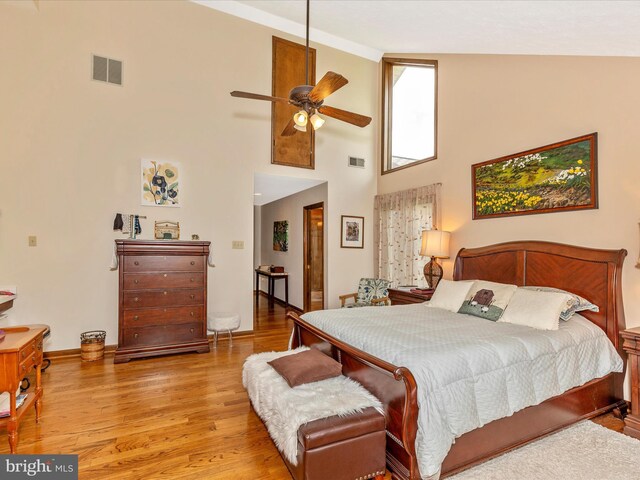 10334 Harp Rd, Walkersville, MD 21793 - bedroom featuring baseboards, visible vents, a high ceiling, and light wood-style floors