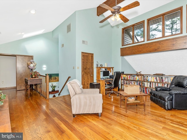 10334 Harp Rd, Walkersville, MD 21793 - living room featuring wood finished floors, visible vents, a ceiling fan, and high vaulted ceiling