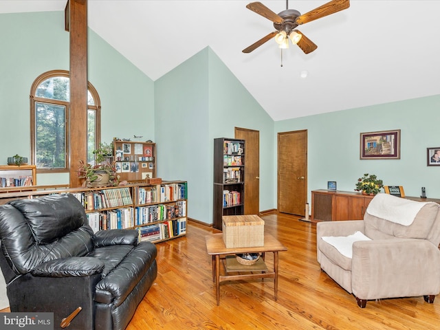 10334 Harp Rd, Walkersville, MD 21793 - living area featuring baseboards, wood finished floors, a ceiling fan, and high vaulted ceiling
