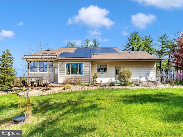 10334 Harp Rd, Walkersville, MD 21793 - back of property with roof mounted solar panels, roof with shingles, and a yard
