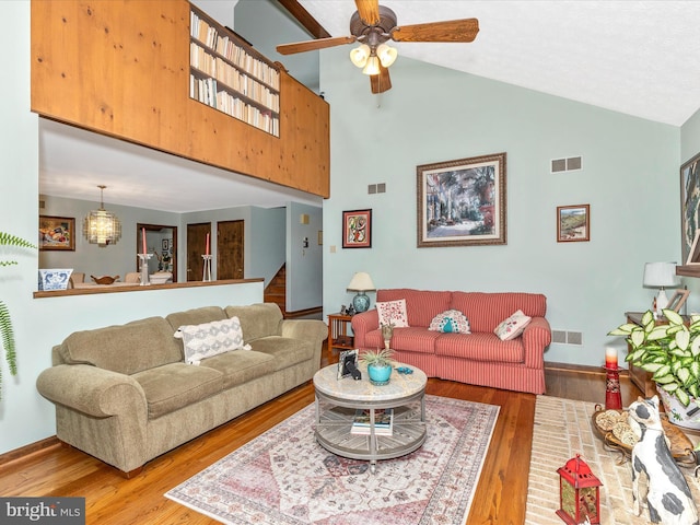 10334 Harp Rd, Walkersville, MD 21793 - living area with wood finished floors, visible vents, a ceiling fan, and high vaulted ceiling