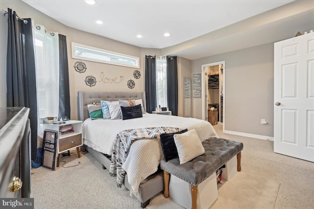 2205 Elsinore Ave, Baltimore, MD 21216 - bedroom with light colored carpet, a spacious closet, recessed lighting, a closet, and baseboards
