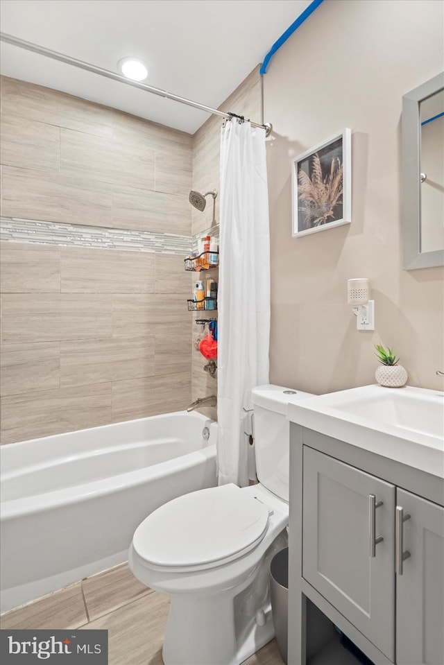 2205 Elsinore Ave, Baltimore, MD 21216 - bathroom featuring shower / bathtub combination with curtain, toilet, vanity, and wood finished floors