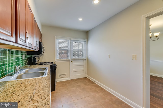 4720 Kimberleigh Rd, Baltimore, MD 21212 - kitchen featuring baseboards, gas stove, recessed lighting, light countertops, and a sink