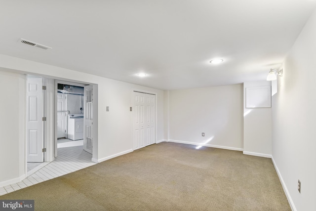 4720 Kimberleigh Rd, Baltimore, MD 21212 - below grade area with washing machine and clothes dryer, baseboards, carpet flooring, and visible vents