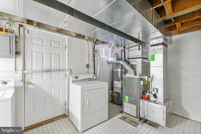 4720 Kimberleigh Rd, Baltimore, MD 21212 - laundry area with laundry area, light tile patterned floors, gas water heater, and washer / dryer