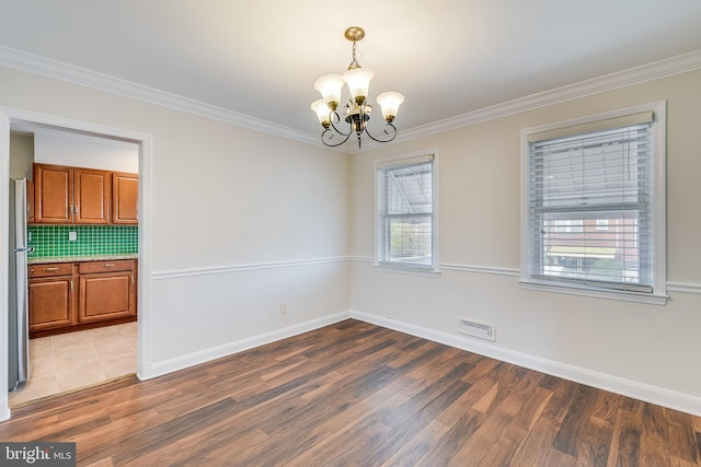 4720 Kimberleigh Rd, Baltimore, MD 21212 - spare room with light wood-type flooring, crown molding, a notable chandelier, and baseboards