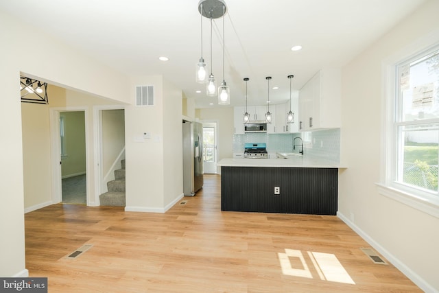 5315 Kenilworth Ave, Baltimore, MD 21212 - kitchen with white cabinets, stainless steel appliances, visible vents, and light countertops