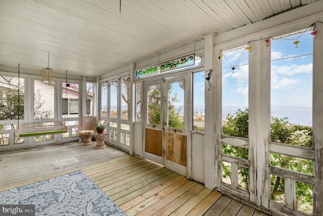sunroom / solarium featuring a healthy amount of sunlight