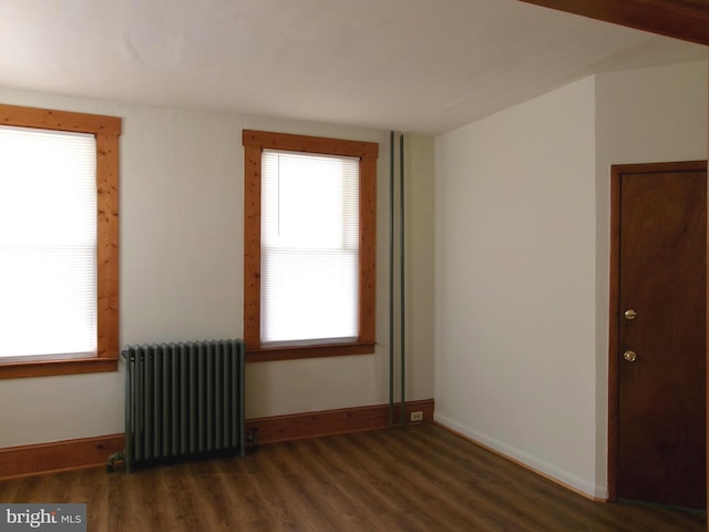 4204 Kenwood Ave, Baltimore, MD 21206 - spare room featuring radiator, baseboards, and wood finished floors