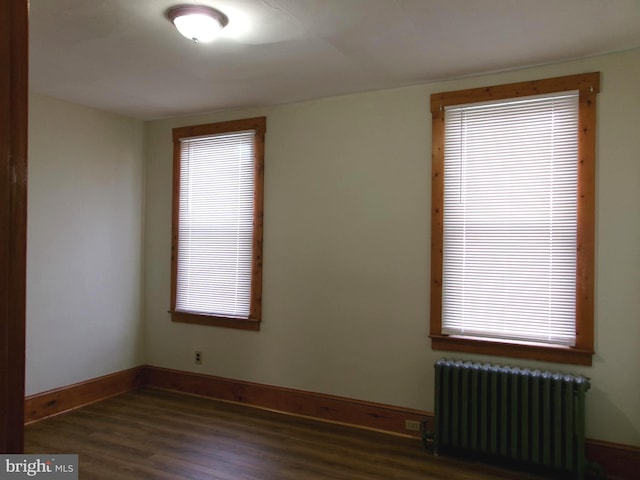 4204 Kenwood Ave, Baltimore, MD 21206 - spare room with baseboards, wood finished floors, and radiator heating unit