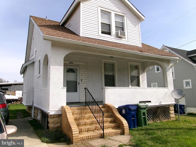 4204 Kenwood Ave, Baltimore, MD 21206 - view of front facade featuring covered porch, roof with shingles, and cooling unit