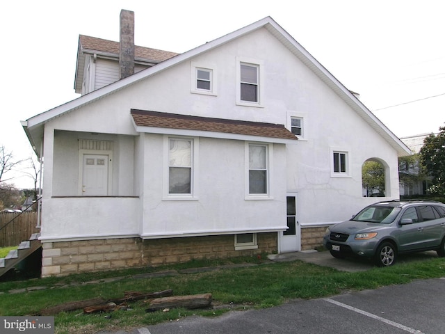 4204 Kenwood Ave, Baltimore, MD 21206 - view of side of property featuring stucco siding and a shingled roof