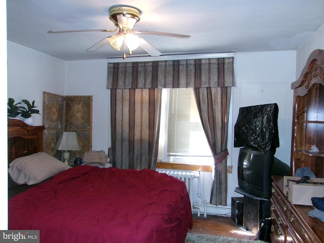 4204 Kenwood Ave, Baltimore, MD 21206 - bedroom with ceiling fan, wood finished floors, and radiator
