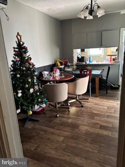 233 Noble St, Kutztown, PA 19530 - dining space with a notable chandelier, wood finished floors, and a textured ceiling