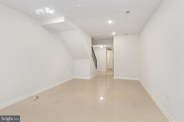 additional living space featuring baseboards, stairs, recessed lighting, and light tile patterned floors