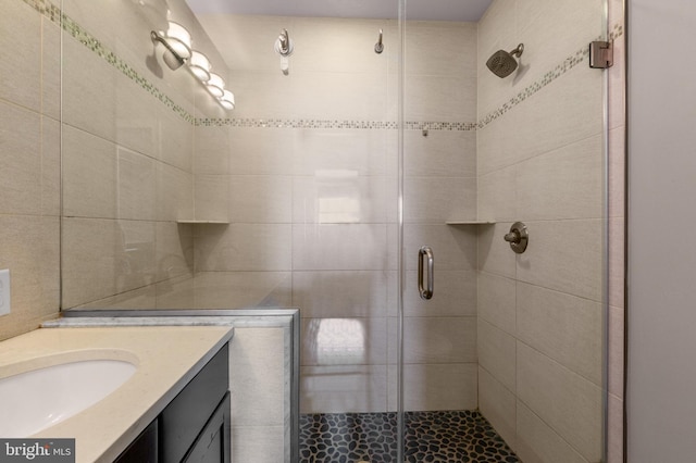 bathroom featuring vanity and a shower stall
