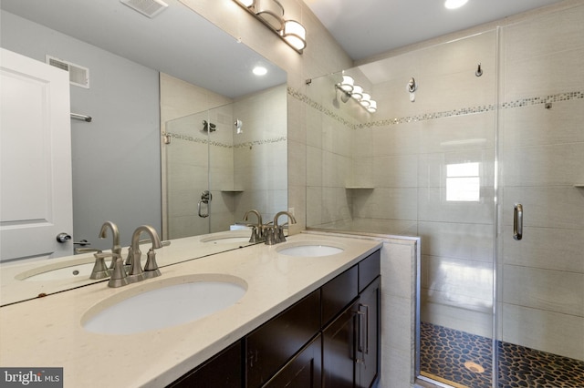 full bathroom featuring visible vents and a sink