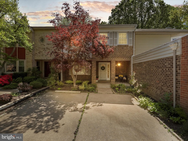 view of property with brick siding