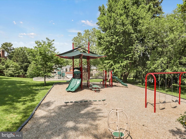 community playground featuring a lawn
