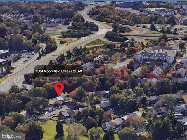 birds eye view of property with a residential view