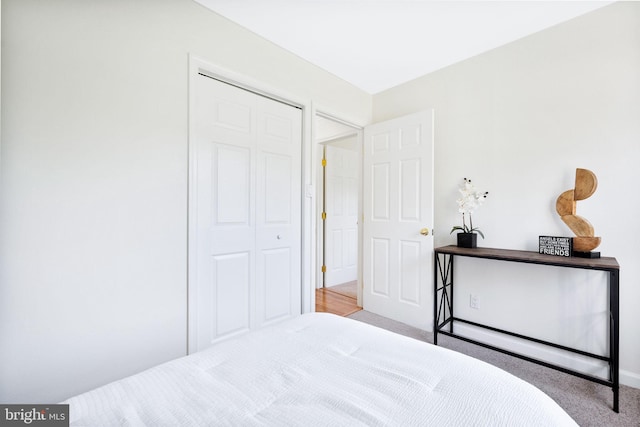 carpeted bedroom with a closet