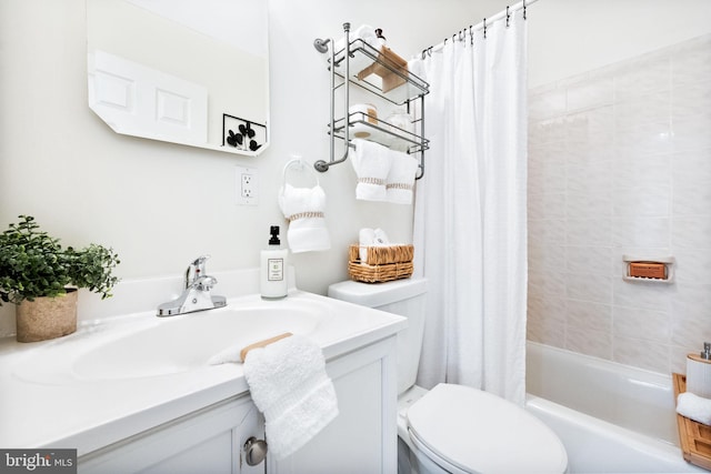 full bathroom featuring vanity, shower / tub combo, and toilet