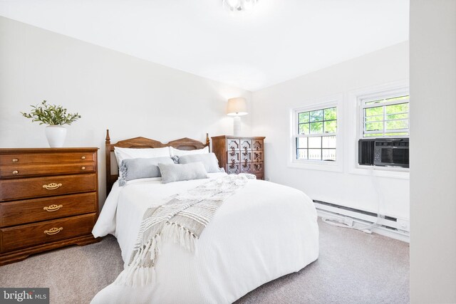 bedroom featuring baseboard heating, carpet, and cooling unit