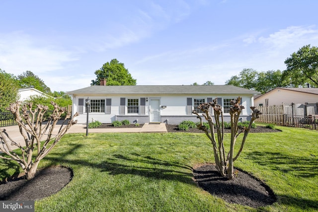single story home featuring brick siding, fence, a chimney, and a front lawn
