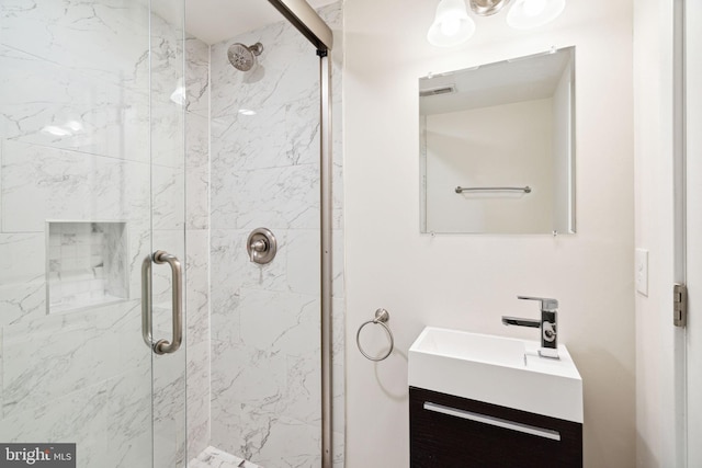 1256 S 27th St, Philadelphia, PA 19146 - bathroom with a marble finish shower, visible vents, and vanity