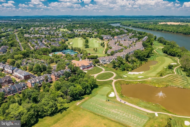 birds eye view of property featuring view of golf course, a water view, and a residential view
