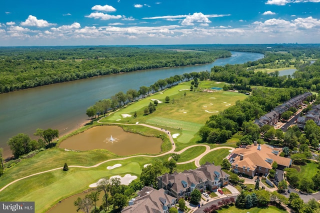 bird's eye view with view of golf course, a water view, a residential view, and a forest view
