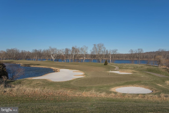 view of home's community featuring a water view and view of golf course