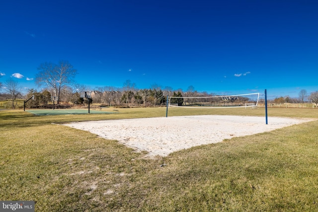 view of community featuring a yard and volleyball court