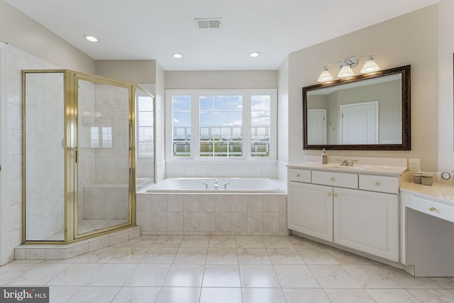 full bath with visible vents, a shower stall, a garden tub, and marble finish floor