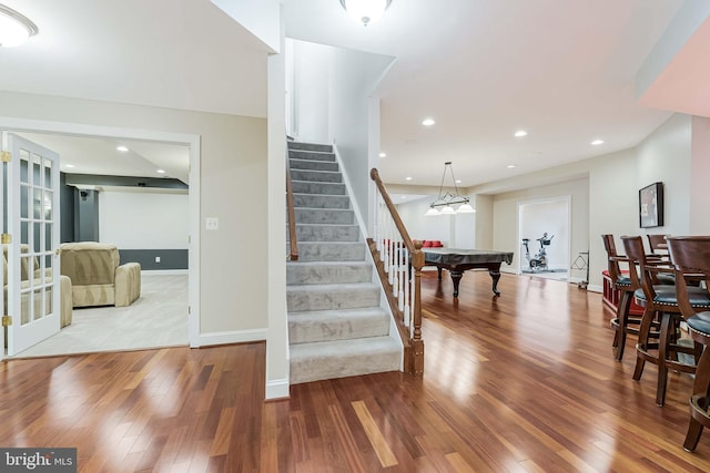 stairway featuring recessed lighting, baseboards, wood-type flooring, and pool table