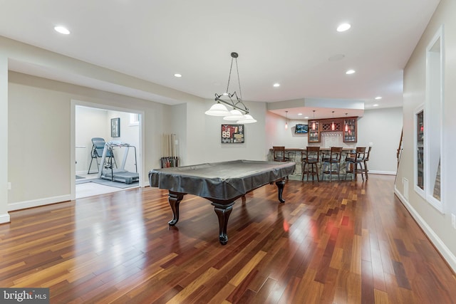 playroom with baseboards, recessed lighting, indoor wet bar, pool table, and wood finished floors