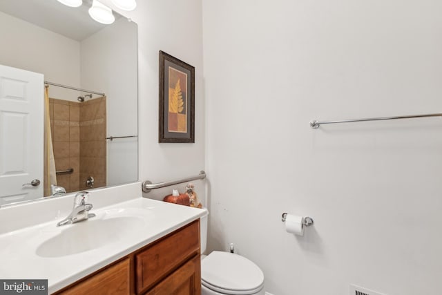 full bathroom with toilet, vanity, and walk in shower