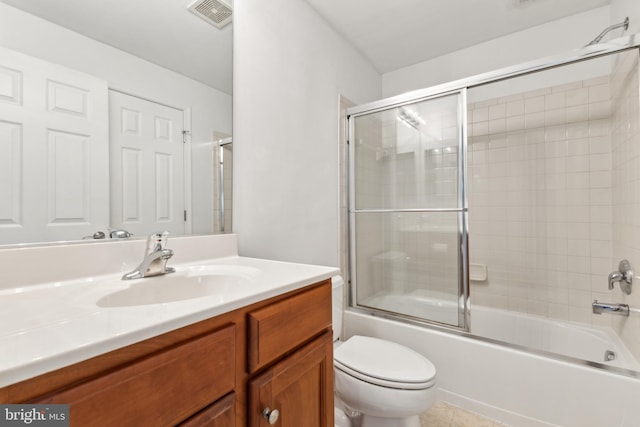 full bathroom featuring visible vents, toilet, vanity, and enclosed tub / shower combo