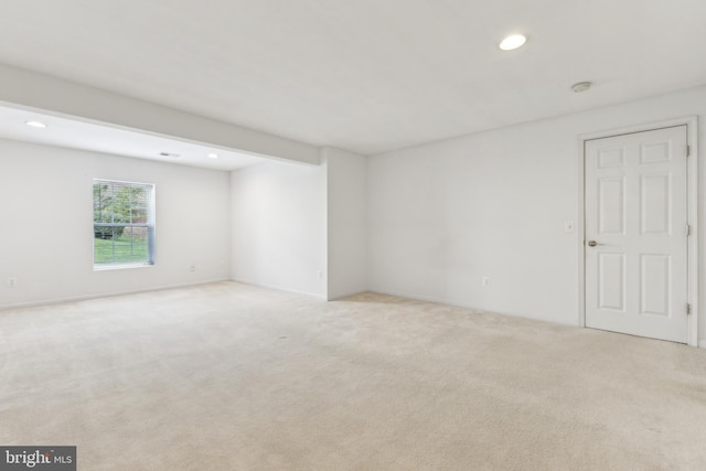empty room featuring light colored carpet and recessed lighting