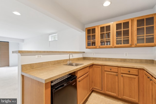 kitchen featuring recessed lighting, a peninsula, glass insert cabinets, black dishwasher, and a sink