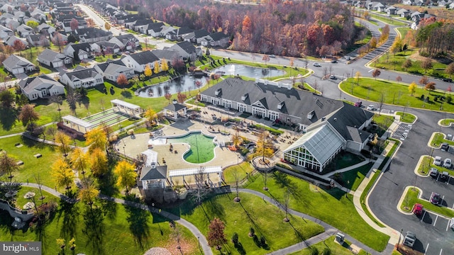 drone / aerial view featuring a residential view and a water view