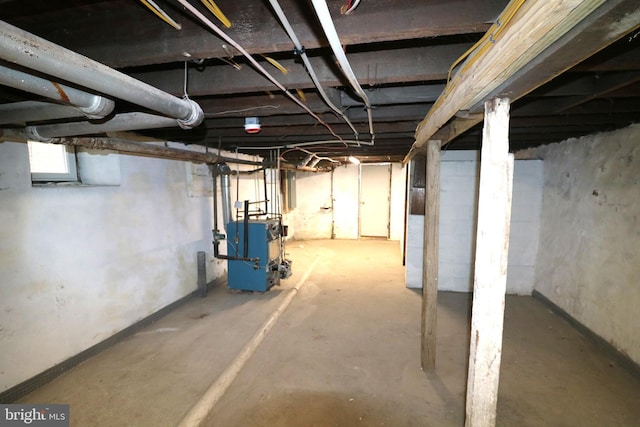 below grade area with a heating unit