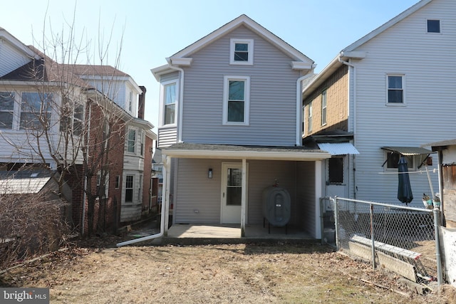 back of house featuring fence and a patio