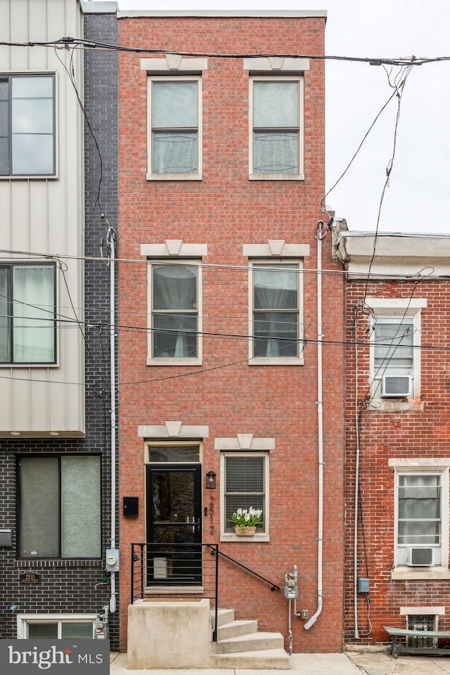 2512 Collins St, Philadelphia, PA 19125 - townhome / multi-family property featuring brick siding and cooling unit