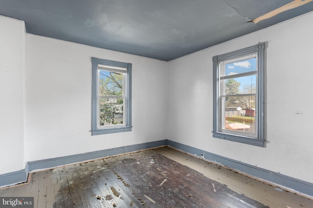 702 Chestnut St, Delanco, NJ 08075 - spare room with baseboards, hardwood / wood-style flooring, and a wealth of natural light