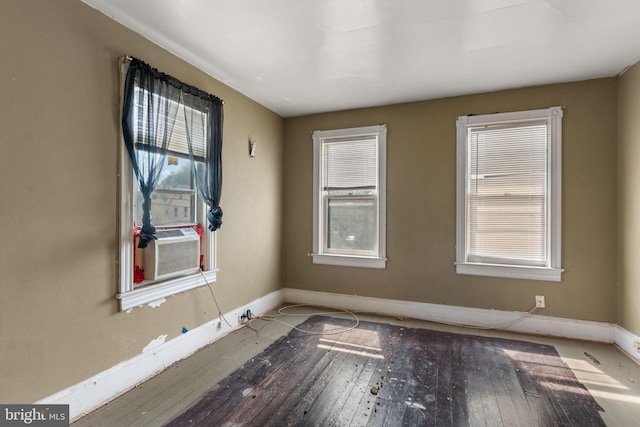 702 Chestnut St, Delanco, NJ 08075 - spare room with plenty of natural light, hardwood / wood-style flooring, cooling unit, and baseboards