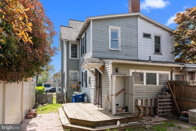 702 Chestnut St, Delanco, NJ 08075 - back of house featuring fence and a chimney