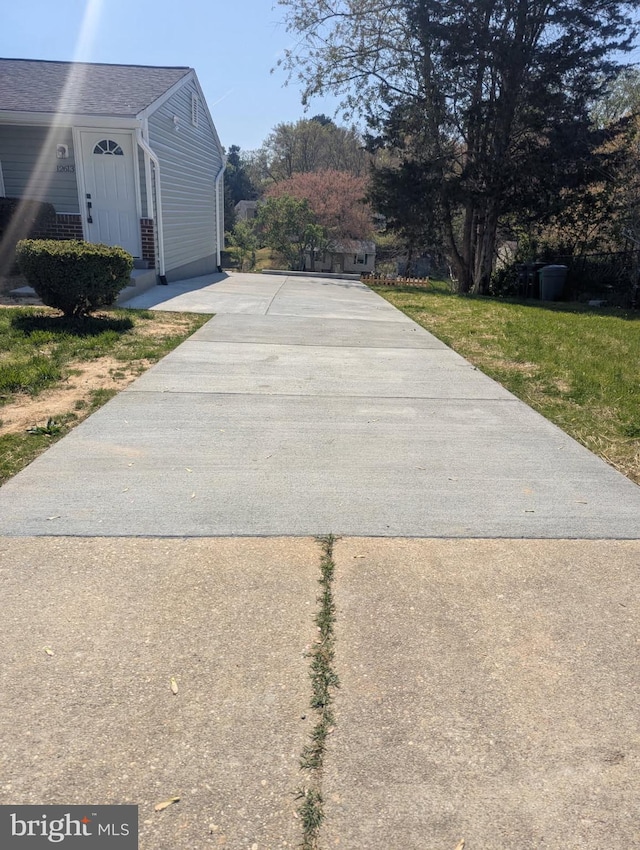 exterior space with concrete driveway